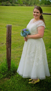 Oleg Cassini 'Tea Length' size 16 used wedding dress side view on bride