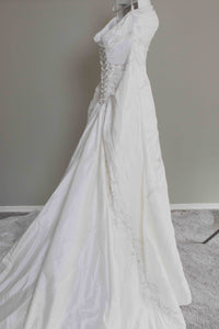 Custom 'Meagan Schlottmann'  size 16 used wedding dress side view on hanger