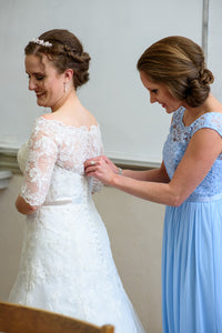 Davids Bridal 'Jewel' size 6 used wedding dress  side view on bride