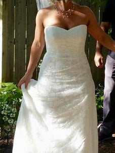 David's Bridal 'Lace Strapless' size 8 used wedding dress front view on bride