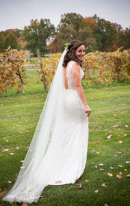 Olia Zavonzia 'Mel' size 8 used wedding dress side view on bride