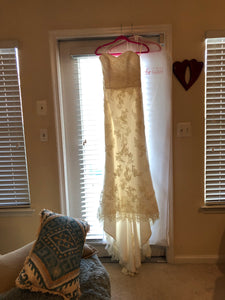 La Reve 'Princess' size 6 used wedding dress front view on hanger