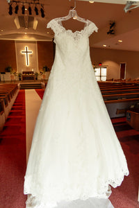 Maggie Sottero 'Kaitlyn' size 14 used wedding dress front view on hanger