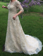 Load image into Gallery viewer, Oleg Cassini &#39;CWG630&#39; size 6 new wedding dress side view on bride
