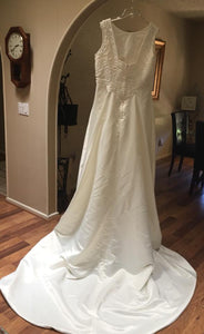 Custom Boutique 'Mor Le' size 16 used wedding dress back view on hanger