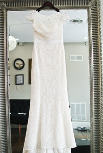 Amy Kuschel 'Babe' size 10 sample wedding dress front view on hanger