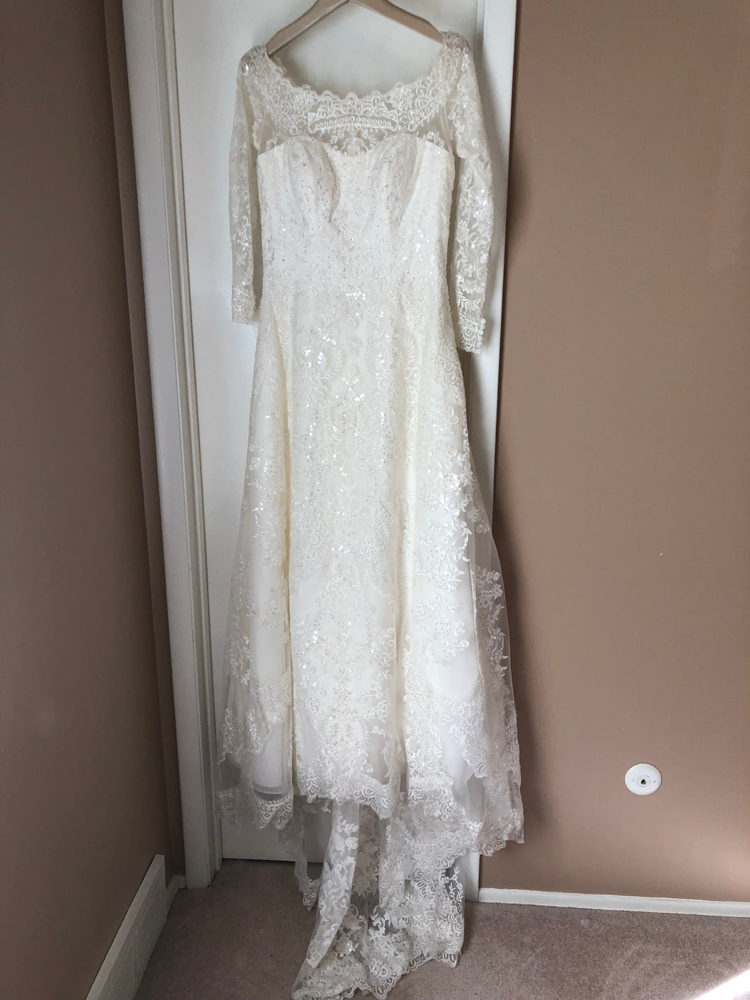 Oleg Cassini 'Off Shoulder Lace' size 10 used wedding dress front view on hanger