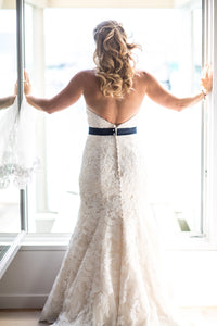 Custom 'Classic' size 12 used wedding dress back view on bride