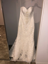 Load image into Gallery viewer, Oleg Cassini &#39;Sweetheart Beaded Lace&#39; size 6 sample wedding dress front view on hanger
