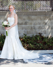 Load image into Gallery viewer, Oleg Cassini &#39;CWG594&#39; size 4 used wedding dress front view on bride
