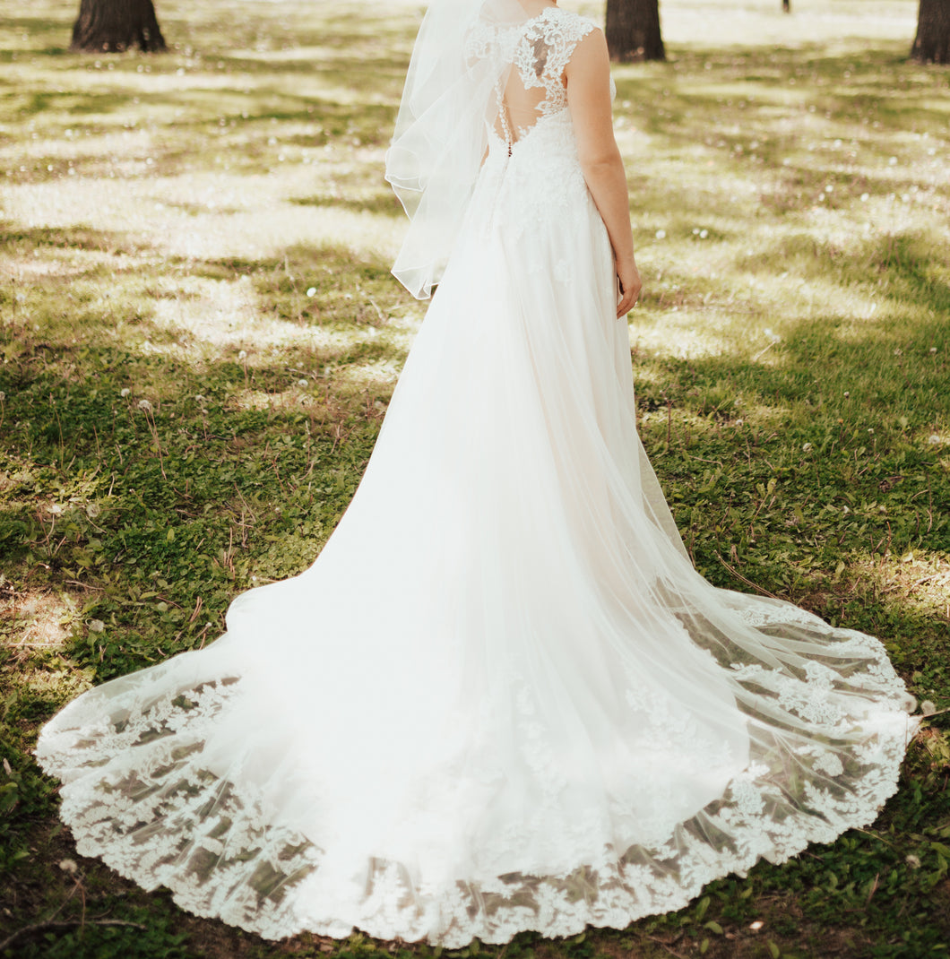 Essense of Australia 'D1999' size 8 used wedding dress back view on bride