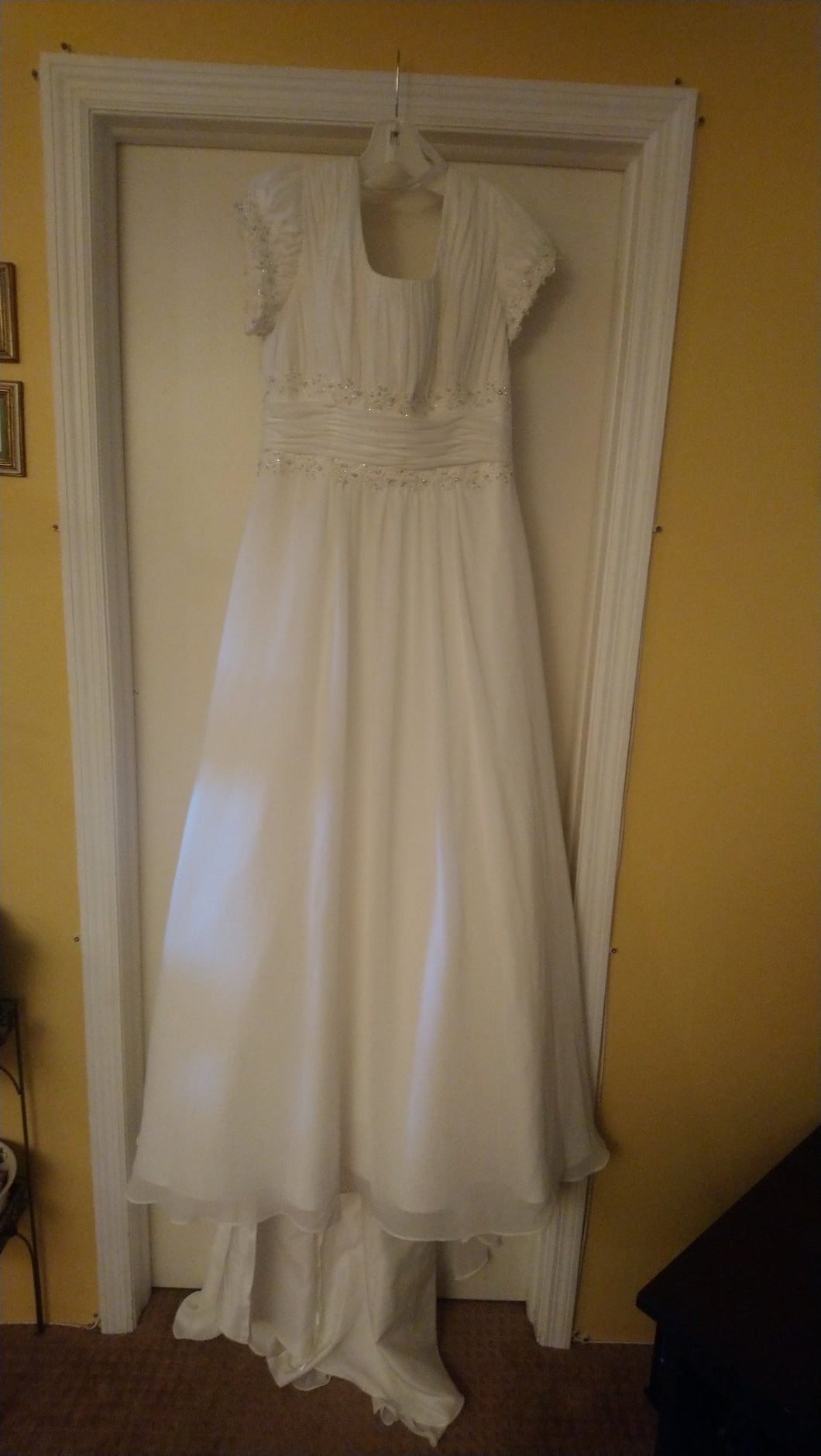 David's Bridal 'Beautiful' size 16 new wedding dress front view on hanger