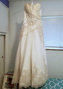 Maggie Sottero 'Strapless' size 4 used wedding dress front view on hanger