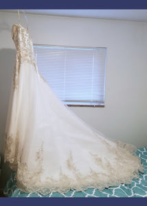 Maggie Sottero 'Strapless' size 4 used wedding dress side view on hanger