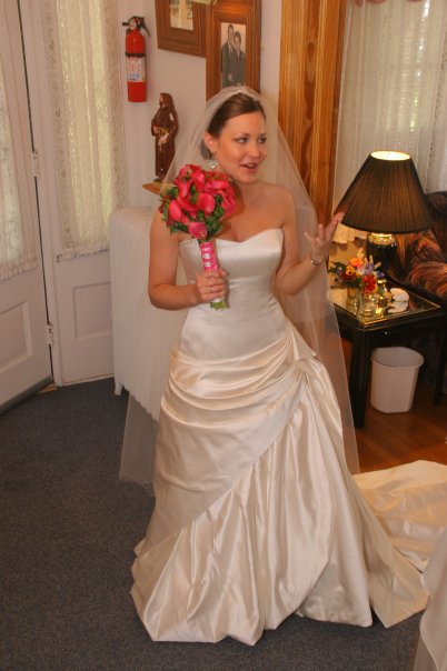 Custom 'Gorgeous Italian Silk' size 4 used wedding dress front view on bride