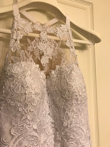 Pronovias 'Lace' size 10 used wedding dress front view on hanger