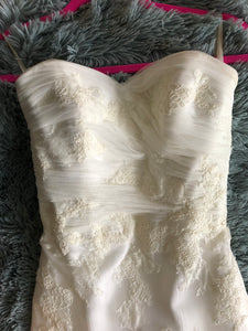 La Reve 'Princess' size 6 used wedding dress front view close up on hanger