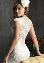 Load image into Gallery viewer, Allure Bridals &#39;Last Minute Bride&#39; size 2 used wedding dress back view on model
