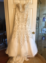Load image into Gallery viewer, Oleg Cassini &#39;Classic&#39; size 4 new wedding dress back view on hanger
