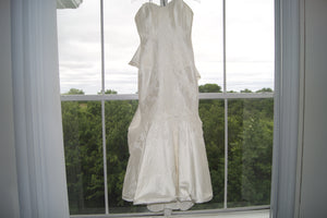 Matthew Christopher 'Poppy' size 8 sample wedding dress front view on hanger