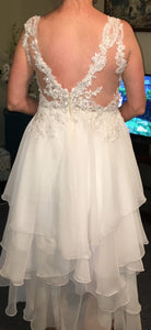 Custom 'Ivory' size 10 new wedding dress back view on bride