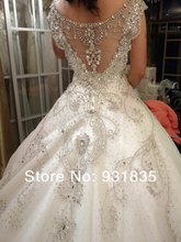 Load image into Gallery viewer, Custom &#39;Chellen&#39; size 6 used wedding dress back view on model
