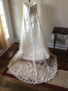 Maggie Sottero 'Romantic' size 6 used wedding dress back view on hanger