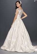 Load image into Gallery viewer, Oleg Cassini &#39;Illusion Cap Sleeve&#39; size 8 new wedding dress back view on model

