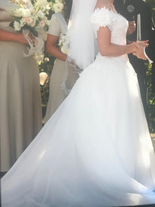 Custom 'White Silk' size 6 used wedding dress side view on bride