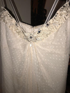 Carolina Herrera 'Chiffon' size 12 used wedding dress close up front view on hanger