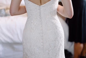 Danielle Caprese 'Sweetheart Mermaid' size 4 used wedding dress back view on bride