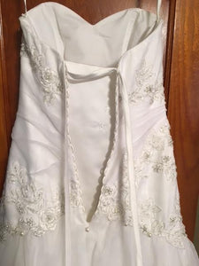 David's Bridal 'Beaded' size 0 used wedding dress back view on hanger