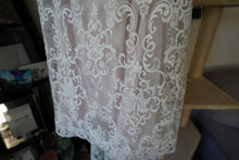 Load image into Gallery viewer, Chic Nostalgia &#39;Lennox&#39; size 8 used wedding dress view of hemline
