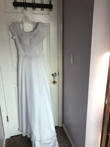 Bonny Bridal 'Sequin' size 4 used wedding dress front view on hanger