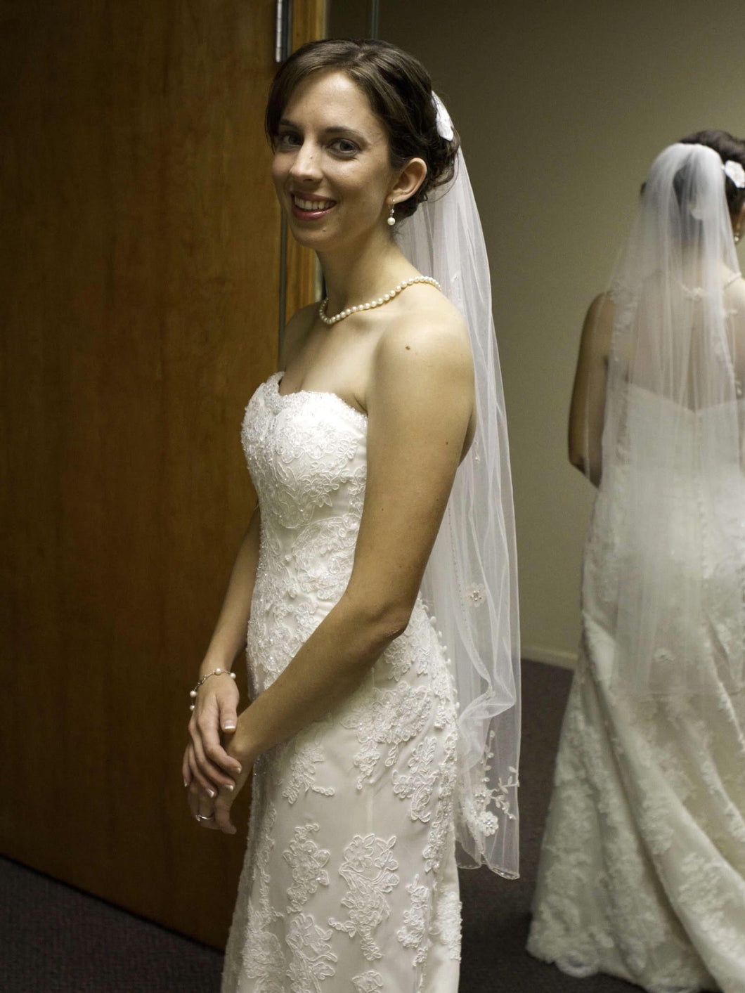 Demetrios 'Lace' size 4 used wedding dress side view on bride