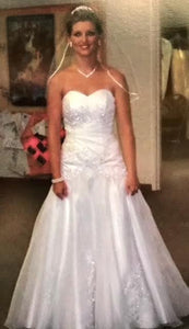David's Bridal 'Beaded' size 0 used wedding dress front view on bride