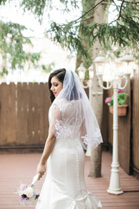 Jewel 'Illusion Neck' size 6 used wedding dress back view close up on bride