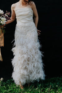 Marchesa 'Ostrich Feathered' size 4 used wedding dress front view on bride