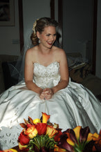 Load image into Gallery viewer, Custom &#39;Strapless Beaded&#39; size 4 used wedding dress front view on bride sitting
