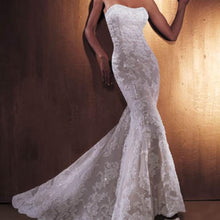 Load image into Gallery viewer, Oleg Cassini &#39;Lace Trumpet&#39; size 8 used wedding dress  front view on model
