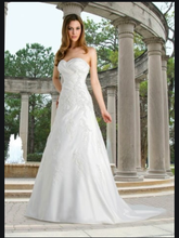 Load image into Gallery viewer, David&#39;s Bridal &#39;Strapless Pleated A-Line&#39; size 4 used wedding dress front view on model
