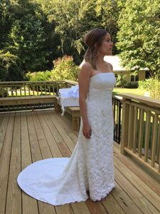 Augusta Jones 'Strapless' size 8 used wedding dress side view on bride