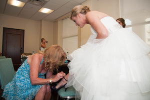 MTA Solano 'Ivory Elegance' size 4 used wedding dress side view on bride
