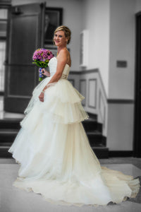 MTA Solano 'Ivory Elegance' size 4 used wedding dress side view on bride