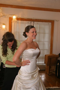 Custom 'Gorgeous Italian Silk' size 4 used wedding dress front view on bride