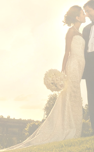 Elizabeth Fillmore 'Strapless' size 0 used wedding dress side view on bride