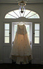 Load image into Gallery viewer, Rivendall Bridal &#39;Lorna&#39; size 18 used wedding dress back view on hanger
