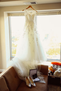 Pronovias 'Mia' size 2 used wedding dress front view on hanger